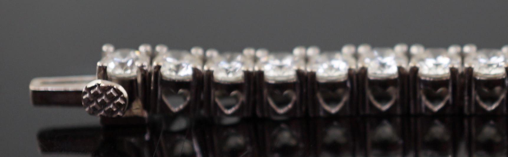 An 18k white gold and diamond line bracelet